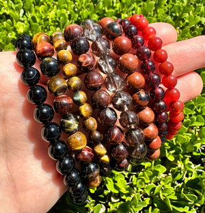 tiger's eye, smoky quartz, garnet and carnelian crystal bracelets at the serenity space